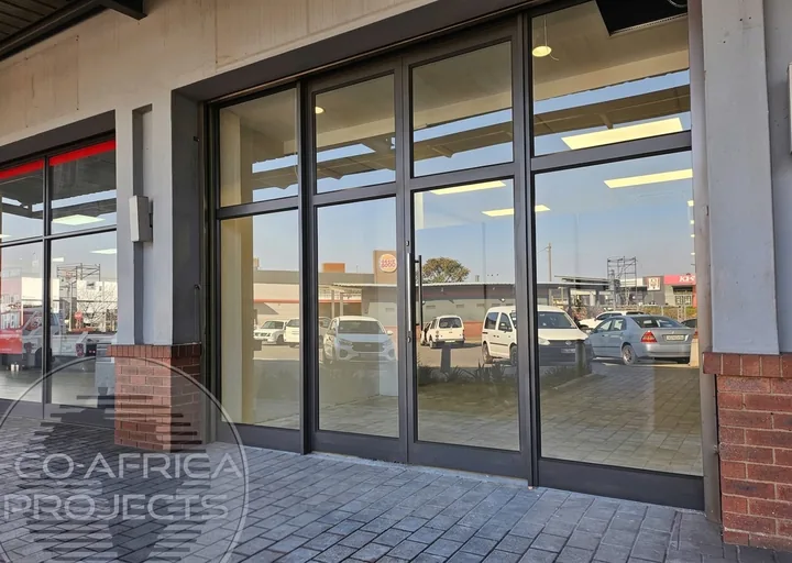 Black aluminium-framed standard shopfront