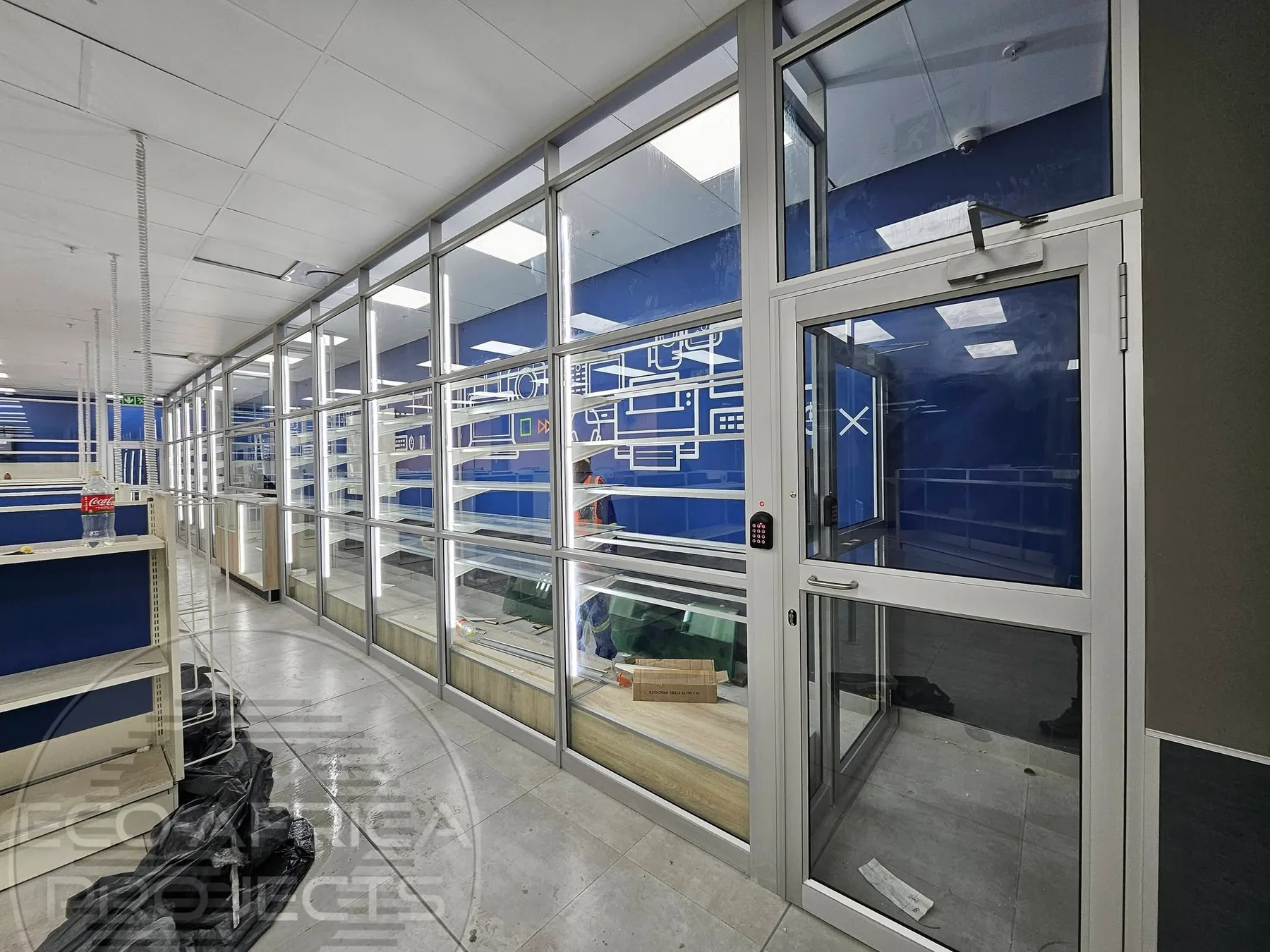 Aluminium-framed commercial glass partition and entrance installation