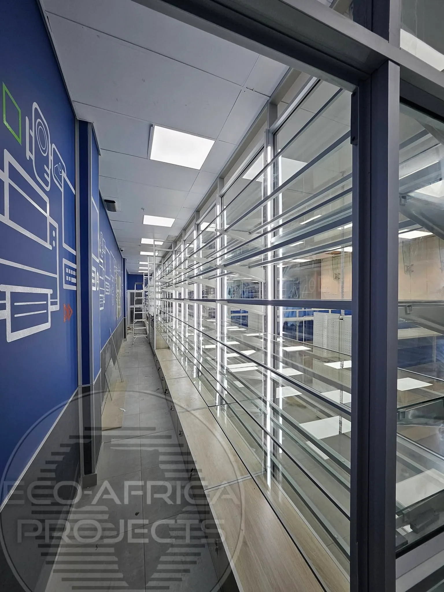 Close view of aluminium framing and glass shelves